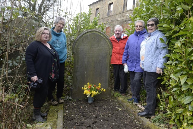 Friends of Loxley cemetery members Tricia Childs, Susan Fisher, Malcolm Nunn, Jane Pratt, and Lynda Barnett lay flowers on the Bates family Grave who lost their lives in the Great Flood of 1864