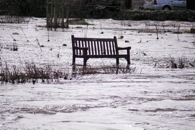 A bench left marooned in the flood water.