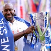 MAGIC MOMENT: Sheffield Wednesday boss Darren Moore celebrates with the trophy after his team's victory against Barnsley sealed promotion to the Championship at Wembley Stadium on Monday, Picture: Richard Heathcote/Getty Images.