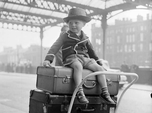 Three-year-old Paul Flannigan sits on top of the luggage ready to go on holiday at St Enoch Station in 1957.
