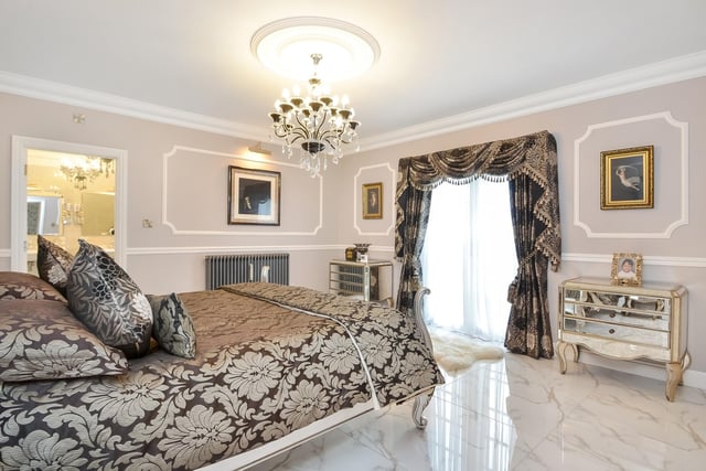 This huge five-bedroom Portsdown Hill home in Portsmouth is up for raffle. Pictured is the property's 4.57m x 4.32m master bedroom suite.