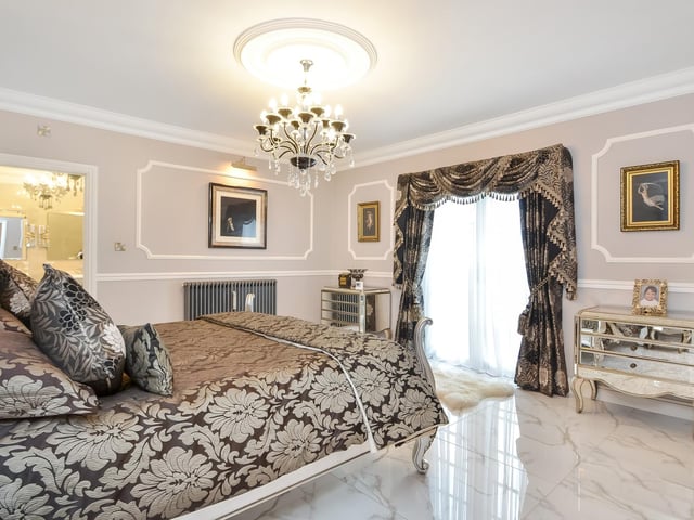 This huge five-bedroom Portsdown Hill home in Portsmouth is up for raffle. Pictured is the property's 4.57m x 4.32m master bedroom suite.
