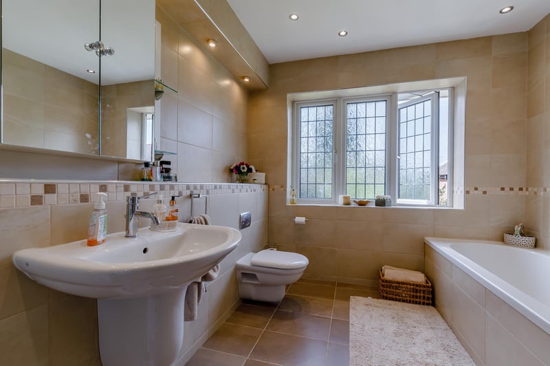 The family bathroom is fitted with a bath, wash basin, separate shower enclosure, WC and underfloor heating