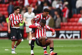 New Sheffield United signing Ben Godfrey lifts Tyrese Campbell of Sheffield United off the floor during the Sky Bet Championship match against Millwal at Bramall Lane. Picture: Simon Bellis / Sportimage