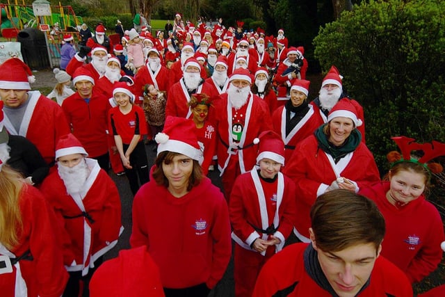 Runners waiting for the start off the annual Santa Run in Ward Jackson Park.