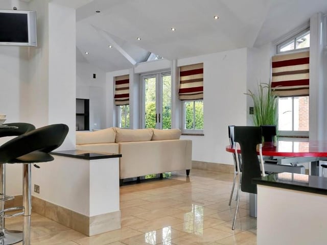 Ever wanted to know what a sun room looks like? Well, here you have it - an extension of the kitchen but ideal for entertaining in its own right, boasting three sets of patio doors, leading outside, and room for a TV system.