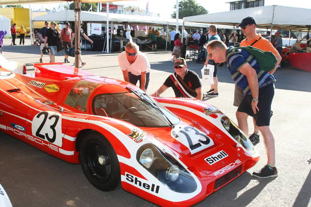 Visitors admire one of the cars. Photo by Derek Martin Photography.