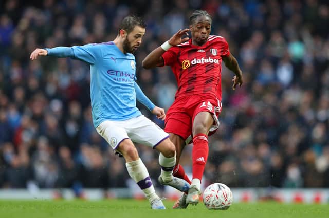 Bernardo Silva of Manchester City is tackled by Terence Kongolo of Fulham during the FA Cup Fourth Round match (Photo by Alex Livesey/Getty Images)