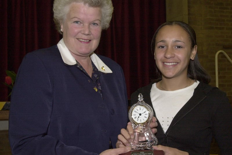 Jessica Ennis recieves the Harold Whitham Trophy from Susan McKiernan at the school sports awards at Handsworth Grange School