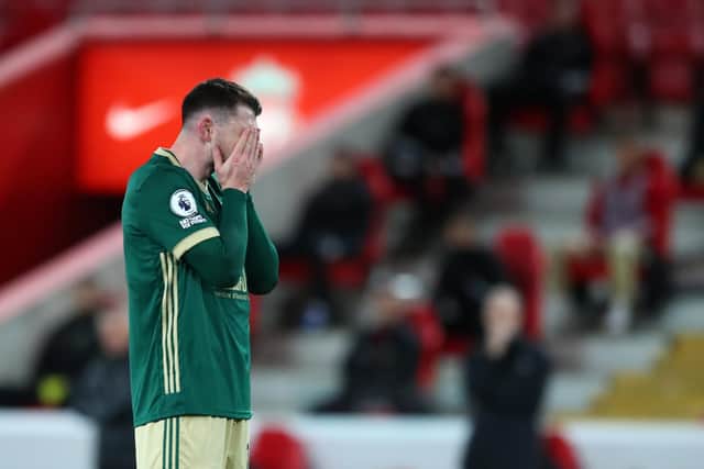 Sheffield United's Oliver Burke looks on dejected after missing a chance at Liverpool last month: Simon Bellis/Sportimage