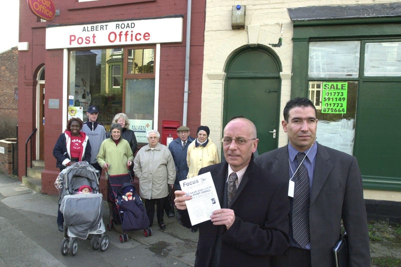 Pictured in 2002 outside Albert Road post office, Heeley, Sheffield, which is under threat of closure. Seen are residents who are unhappy at the plans. Seen front with a petition notice against the closure are, LtoR Coun Steve Ayes, and James Clark Chairman of Meersbrook Tennants Assn.