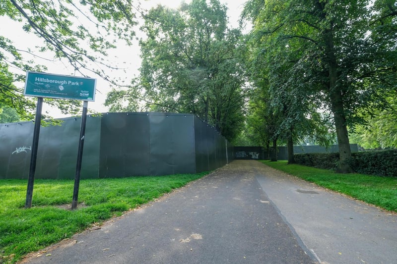 A huge wall is constructed around Hillsborough PArk for the music festival.