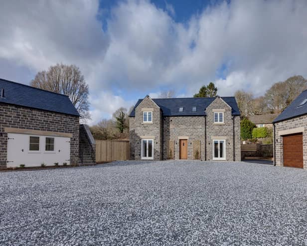 Whitegates is a newly built four bedroomed detached country home with a one bedroomed detached barn and double garage. It is in a beautiful semi-rural location with around three acres of gardens and grounds with far reaching views.