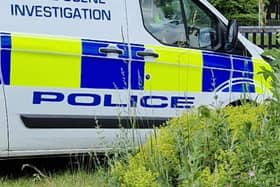 Two injured: File picture shows police at a crime scene. Photo: David Kessen