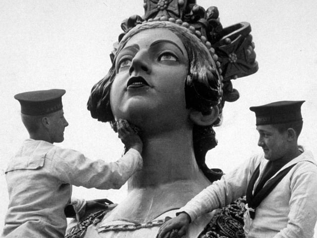 5th April 1934:  Sailors from the naval training college at Gosport, giving a statue of HM Queen Victoria a soap and water wash.  (Photo by Reg Speller/Fox Photos/Getty Images)