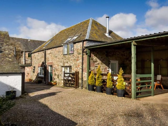 The Bothy is a two bedroom cottage created out of former stables - on the ground floor are two double bedrooms (one of which is an en suite), and on the first floor is an open plan sitting room and kitchen
