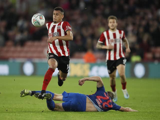 Ravel Morrison of Sheffield United skips past Laurens De Bock of Sunderland during the Carabao Cup match at Bramall Lane, Sheffield. Picture date: 25th September 2019. Picture credit should read: Simon Bellis/Sportimage