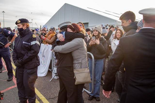 Family members embracing loved ones as they step off HMS Defender. Picture: Habibur Rahman