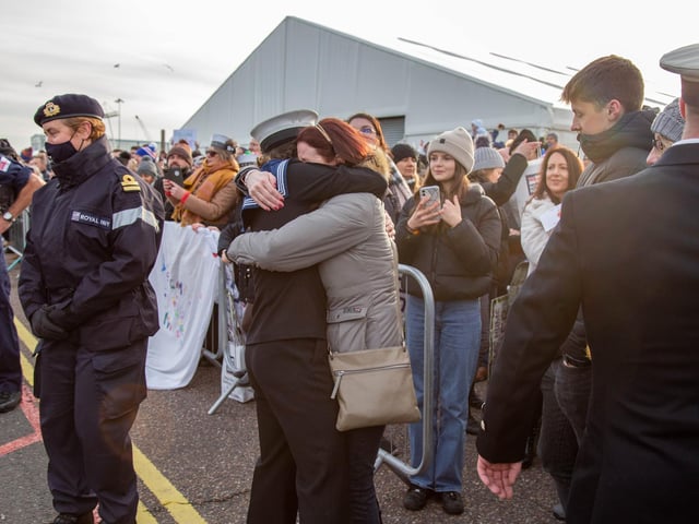 Family members embracing loved ones as they step off HMS Defender. Picture: Habibur Rahman