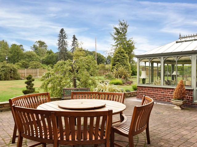 The gardens to three sides of the house are predominantly laid to lawn with established trees, stocked borders and a paved patio leading off the kitchen and garden room.
