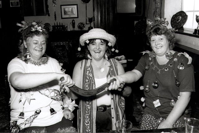 At the Fox and Founds they held a half way to Christmas party with an Australian theme - pictured are, left to right,  Sue Shaw, landlady Dee Wriglesworth and Diane Playfair, July 1996
