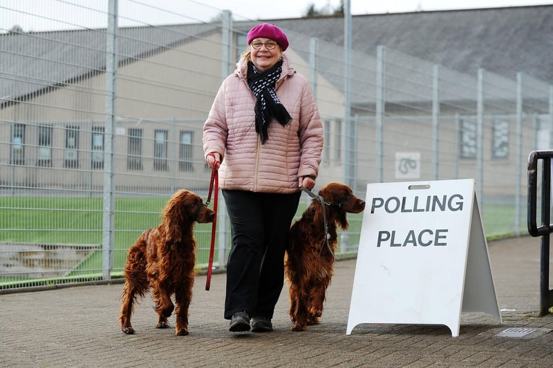 Rosie Riddoch going to vote with her Irish Setters, Flora and Sadie at Woodland Games Hall polling station