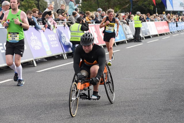 Wheelchair competitor crosses the finish line. Picture: Keith Woodland (171021-0)