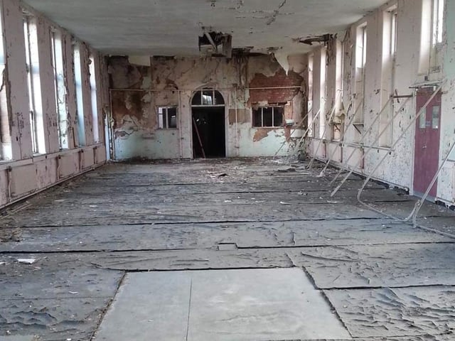 An old ward perhaps - with the old curtain rails where the beds used to be.