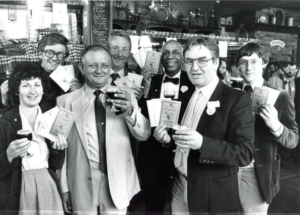 Roger Howill, licensee of the Frog & Parrot, Division Street, celebrating the launch of his new "Roger & Out" special beer in June 1985