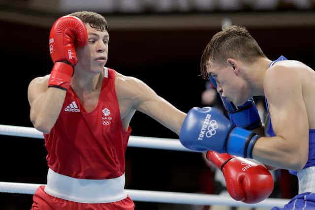 Pat McCormack (L) of Great Britain exchanges punches with Aliaksandr Radzionau of Belarus.
