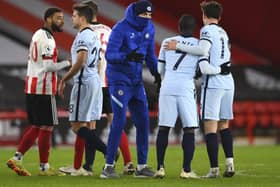 Chelsea's head coach Thomas Tuchel, centre, celebrates with Chelsea's N'Golo Kante and Chelsea's Mason Mount after the Premier League soccer match between Sheffield United and Chelsea at Bramall Lane. (Clive Mason/ Pool via AP)