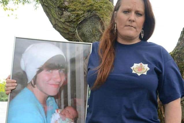 Beckie Ramsay pictured with a photograph of her son Dylan, who drowned in 2011.