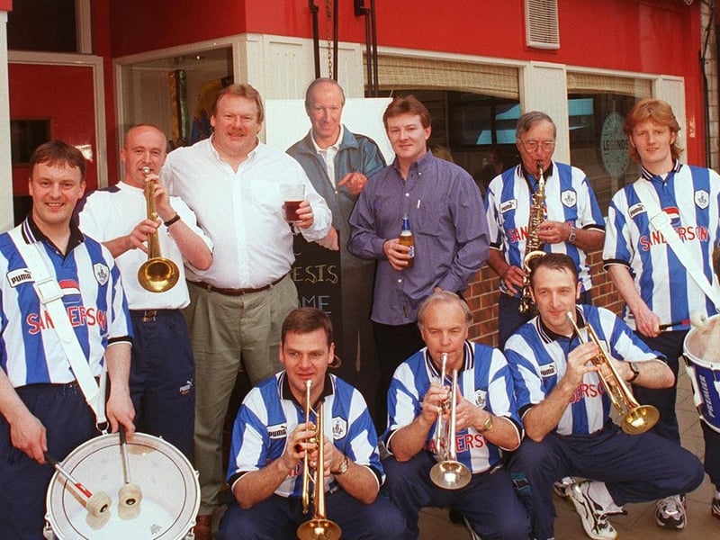 Pictured outside the Legends Sports Bar on Langsett Road, Hillsborough, in 1999 is the Sheffield Wednesday Band with partners in the new bar David Mann and John Lee, at its official opening. The building is now home to the Hillsborough Tap pub.