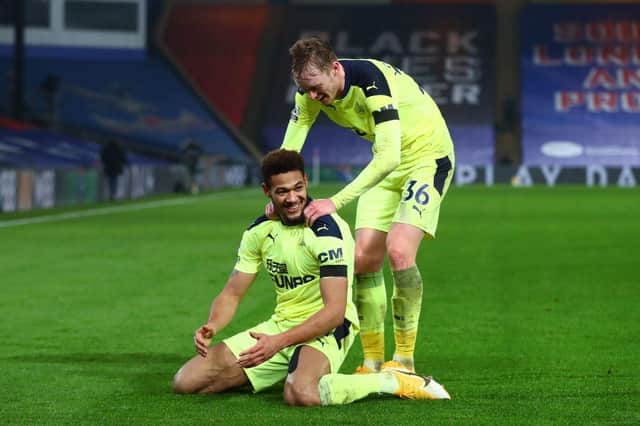 Newcastle United's Brazilian striker Joelinton (L) celebrates with Newcastle United's English midfielder Sean Longstaff (R) after scoring their second goal during the English Premier League football match between Crystal Palace and Newcastle United at Selhurst Park in south London on November 27, 2020.