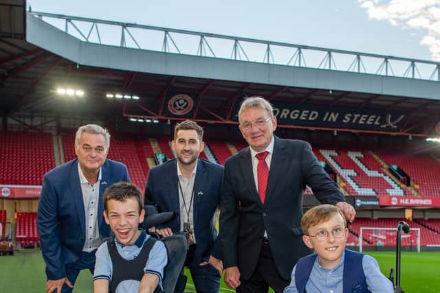 Jack and Tobias with (left to right) Dave McCarthy and Jon Helliwell from Sheffield United with former Blades professional Tony Currie.