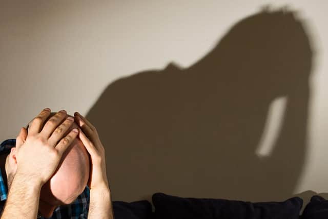 PICTURE POSED BY MODEL A man showing signs of depression. Picture: PA