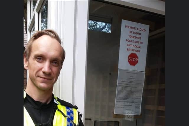 PC Darren Hibberd pictured issuing the papers to close the house in Parson Cross