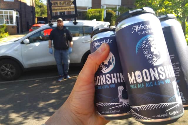 Sales director Dan Baxter delivers some of the first Moonshine in cans.
