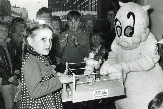 Mascot Gloops tries his hand at Raving Bonkers against 7 years old Karen Toseland at Redgates, where the final of the Junior Star Raving Bonkers contest was held on  August 25,  1973