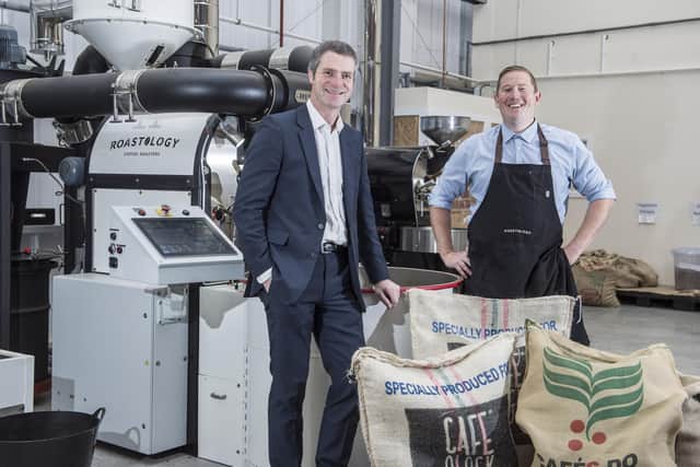 Bryan Unkles and Steve Hampshire with the new roaster at Roastology