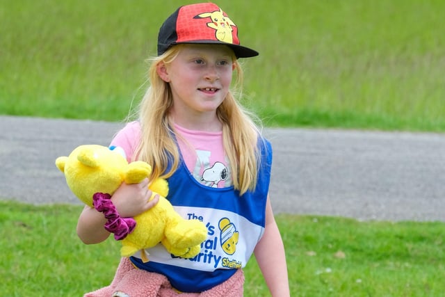 A young walker with her Children's Hospital Charity mascot Theo