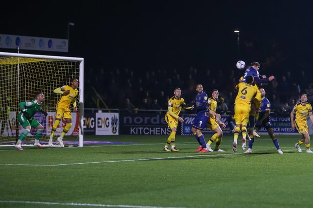 Mansfield Town's Oli Hawkins wins the header in last night's defeat at Sutton.