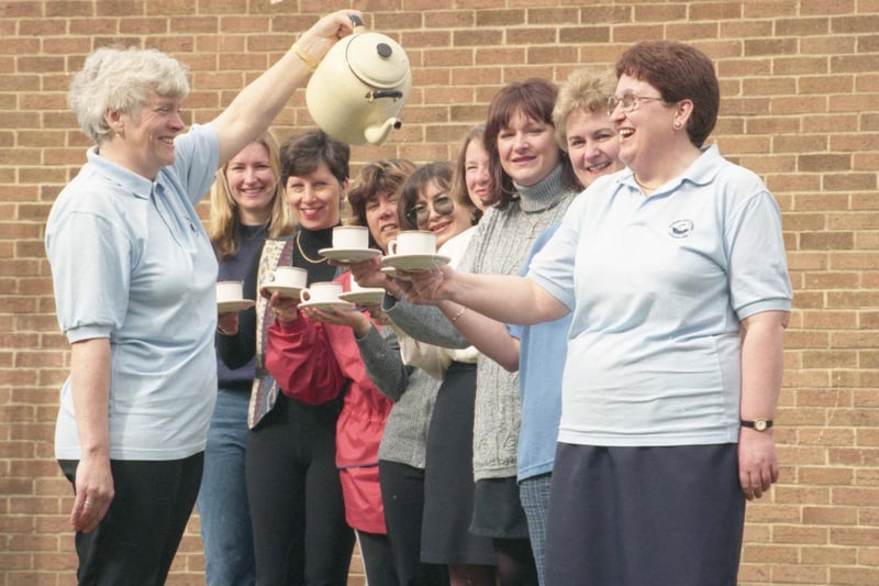 Maureen Batty pours Liz Atkinson a cuppa, watched by fellow members of the parents' group committee of Seaburn Dene Primary School. The group was the highest money-spinner in the region in the 1997 Britain's Biggest D Party, sponsored by Brooke Bond D.
