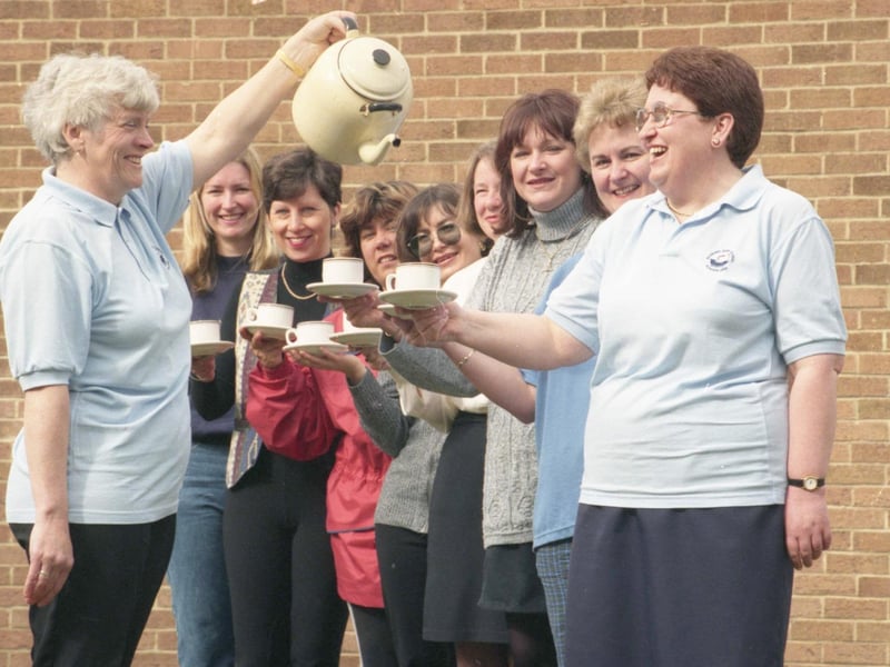 Maureen Batty pours Liz Atkinson a cuppa, watched by fellow members of the parents' group committee of Seaburn Dene Primary School. The group was the highest money-spinner in the region in the 1997 Britain's Biggest D Party, sponsored by Brooke Bond D.