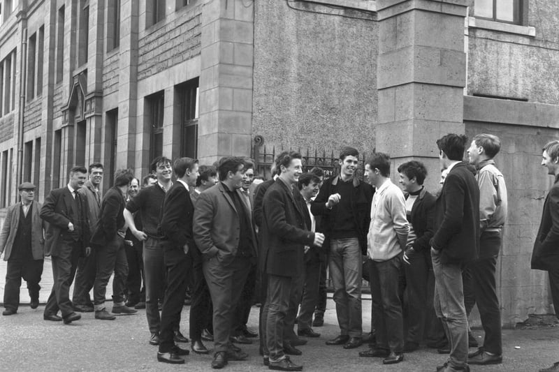 Apprentices stand outside the gates of Bertram & Son Ltd in Leith Walk in June 1966.