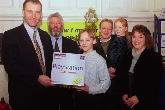 Inspector Ray Mountford and David Baker (Chair of the Early Years development) presented a Playstation to the Litchfield family, Marc, Helen, Scott and Sophie for their ideas bout the futeure of Sheffields Childcare system back in 1998