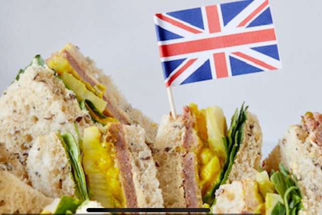VE Day Corned Beef and Piccalilli Sandwich

Serves – 4
Prep time – 10 minutes
Cooking time – 5 minutes

Ingredients:
 8 slices wholemeal bread
 120 gm Hellman’s mayonnaise
 160 gm corned beef - sliced
 120 gm mustard piccalilli
 80 gm mixed leaf - washed
 Searcys seasoning
Method:
 Layout wholemeal bread in a rectangle of 8 slices on a chopping board (2 rows of 4).
 Spread the mayonnaise over bottom slices of bread.
 Lightly season with the Searcys seasoning.
 Lay 40 gm sliced corned beef on to the mayonnaised slice of wholemeal bread.
 Top with corned beef and 20 gm of mixed salad leaf.
 Spread 30 gm of the mustard piccalilli to other slices of bread and ensure you cover to the covers.
 Sandwich the two slices of bread together and push together carefully.
 Store wrapped in clingfilm and refrigerated or use at once.
To Serve
 Cut in half diagonally.