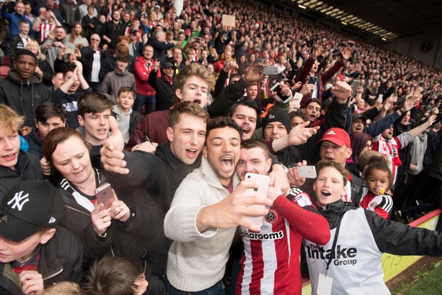 John Fleck has a selfie with fans after winning promotion to the Sky Bet Championship in April 2017.