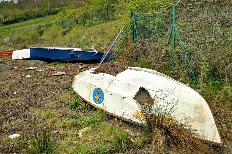An old upturned boat in the abandoned adventure playground.