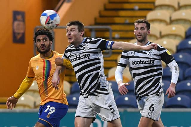 Mansfield's Jamie Reid battles with Forest Green's Chris Stokes. Picture: Andrew Roe/AHPIX LTD